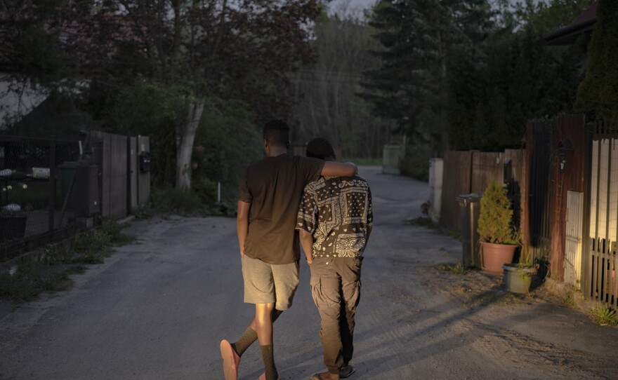 Daniel and Manuel in front of the home.