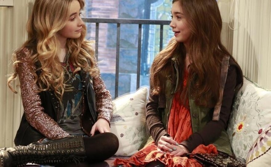 Rowan Blanchard (right) plays Cory and Topanga's 13-year-old daughter, Riley, and Sabrina Carpenter plays her "bad" best friend, Maya, on Girl Meets World.