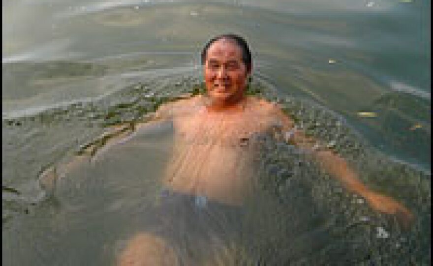 Swimmers in Houhai are proud of China's Olympic gold medals, but say they wish more money could be invested in sports facilities for ordinary people.