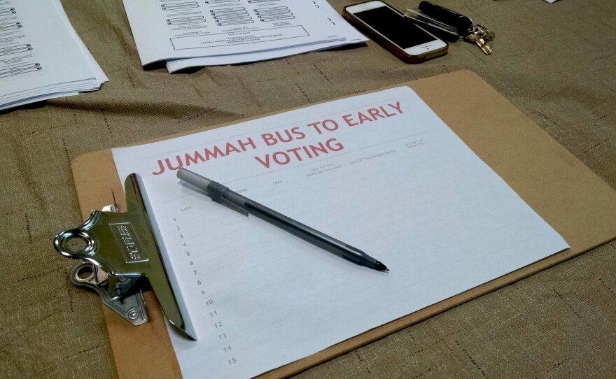 A sign-up sheet for the bus to early voting after Friday prayers
