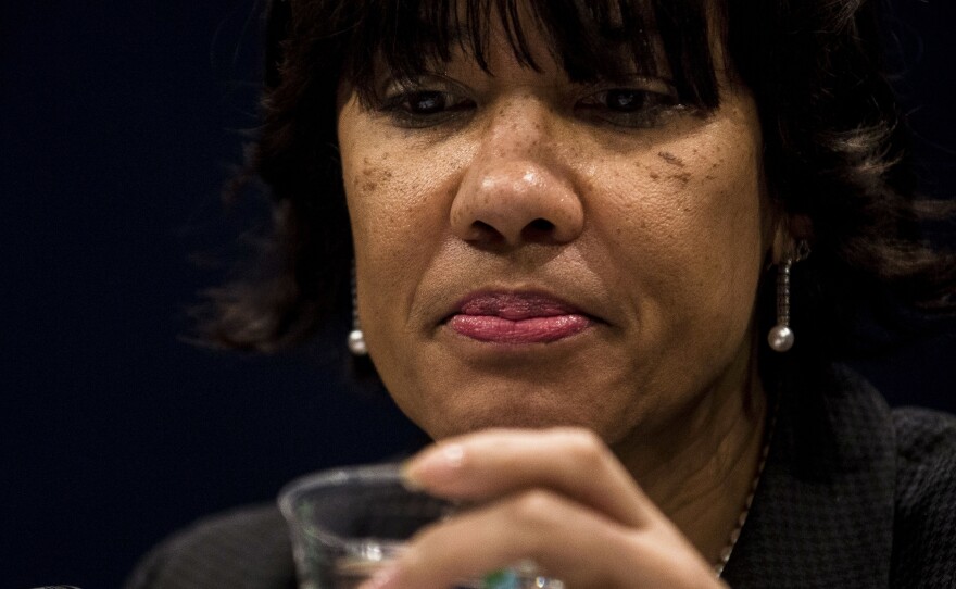 Mayor Karen Weaver takes a sip of water at the House Democratic Steering & Policy Committee hearing titled, "The Flint Water Crisis: Lessons for Protecting America's Children."