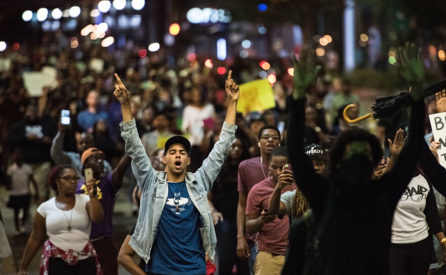 Demonstrators fill a downtown city street during protests on Wednesday night in Charlotte, NC. The protests began the previous night following the fatal shooting of 43-year-old Keith Lamont Scott at an apartment complex near UNC Charlotte.