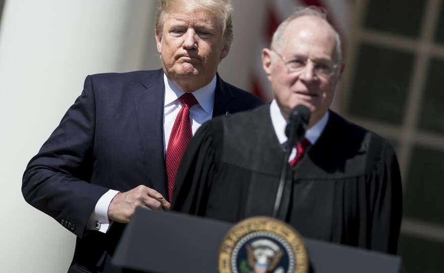 President Trump listens while Supreme Court Justice Anthony Kennedy speaks during a ceremony in the Rose Garden of the White House.