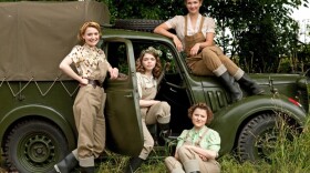 Annie Barratt played by Christine Bottomley; Bea Holloway played by Jo Woodcock; Joyce Fisher played by Becci Gemmell; Nancy Morrell played by Summer Strallen from the television series LAND GIRLS.