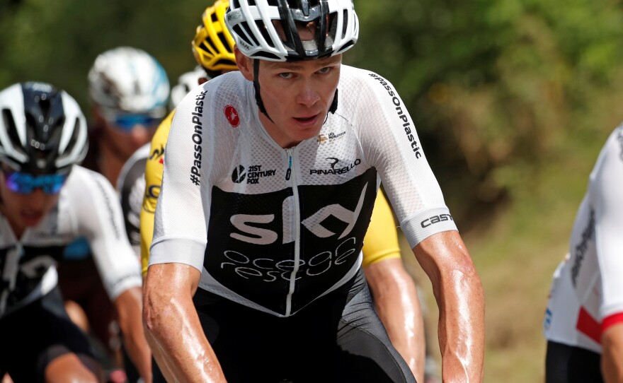 Chris Froome, the defending champion at the Tour de France, has fallen to third place. Along the way, he's been grabbed off his bike by police and struggled to match his top competitors.