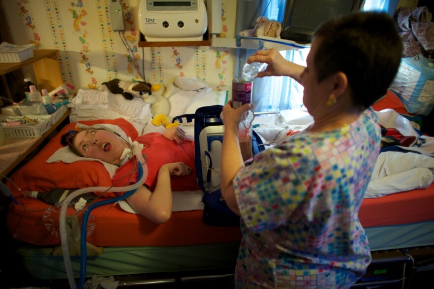 Olivia Welter turns 21 on Nov.9. On her birthday, she will no longer be eligible for the program for disabled children that has kept her healthy. She will lose state funds that cover the expense of nurses like Helen Houchins who prepares liquid food that is sent directly into Welter's stomach through a feeding tube.