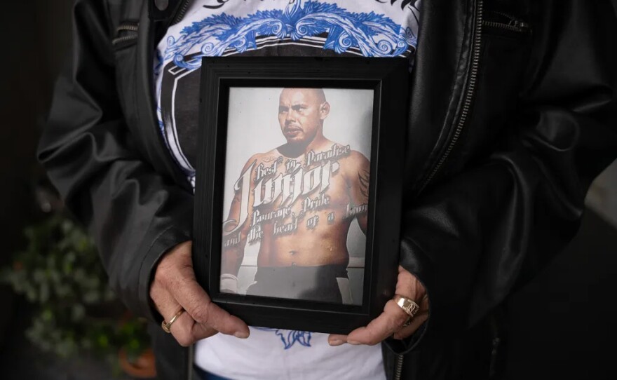 Ruby Marichalar holds a photo of her son, Junior, who was killed at age 28, at her home in San Jose on March 14, 2025. Junior’s dream was to be a mixed martial arts fighter, but he only had the chance to compete once, his mother said.