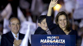 Former first lady and independent presidential candidate Margarita Zavala with Mexico's former President Felipe Calderon, left, waves to supporters during a rally at the start of her campaign for presidential election in Mexico City, early Friday, March 30, 2018.