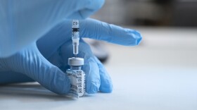 UC Davis Medical Center nurse Heather Donaldson prepares to inoculate a staff member with the Pfizer-BioNTech COVID-19 vaccine, Tuesday, Dec. 15, 2020, in Sacramento, Calif. 