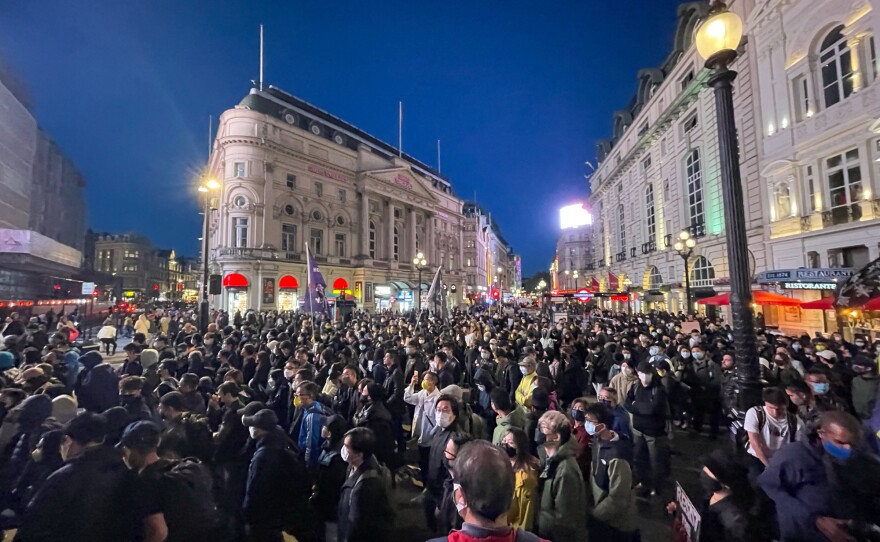 Hundreds of protesters march from London's Piccadilly Circus toward the Chinese Embassy.