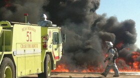 Members of the Aircraft Rescue and Firefighting unit at Marine Corps Air Station Miramar practice extinguishing flames from a jet fuel fire, Oct. 19, 2013. 