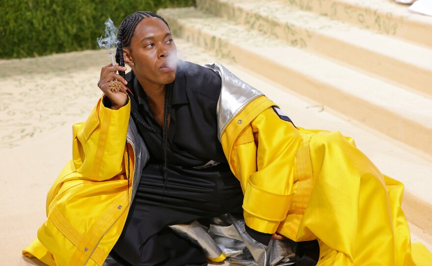 Jeremy O. Harris, wearing a Tommy Hilfiger jacket and zoot-suit-esque pants inspired by one of his favorite Aaliyah outfits: <a href="https://www.cnn.com/style/article/jeremy-o-harris-interview-met-gala-aaliyah/index.html">a "yellow, sailing bomber jacket thing."</a>