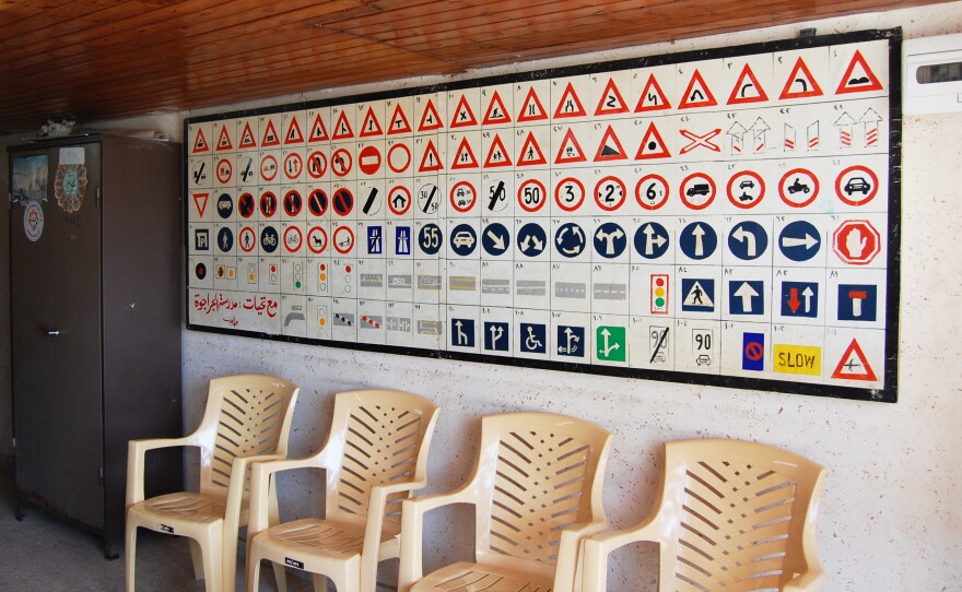 Road signs are displayed at a driving school in Gaza. Knowing the signs is only one challenge to driving in Gaza, where horse and donkey carts clop through traffic and few roads have lane lines.
