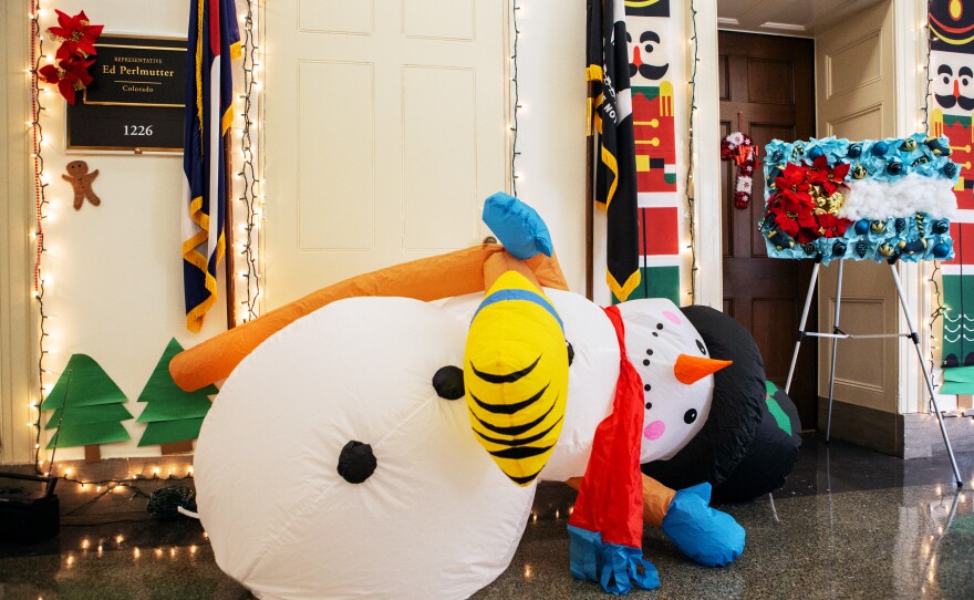 An inflatable snowman slowly deflates outside of Rep. Perlmutter's door. He has repeatedly accused Colorado Democrat Rep. Jason Crow of tampering with the snowman.