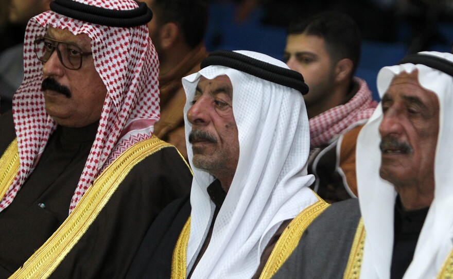 Sunni tribal leaders, Iraqi army officers and government officials attend a tribal conference on fighting the Islamic State group, at the Ain al-Asad air base, on Nov. 11.