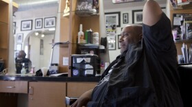 Tau Baraka at his business, Imperial Barbershop in Encanto, Oct. 8, 2014.