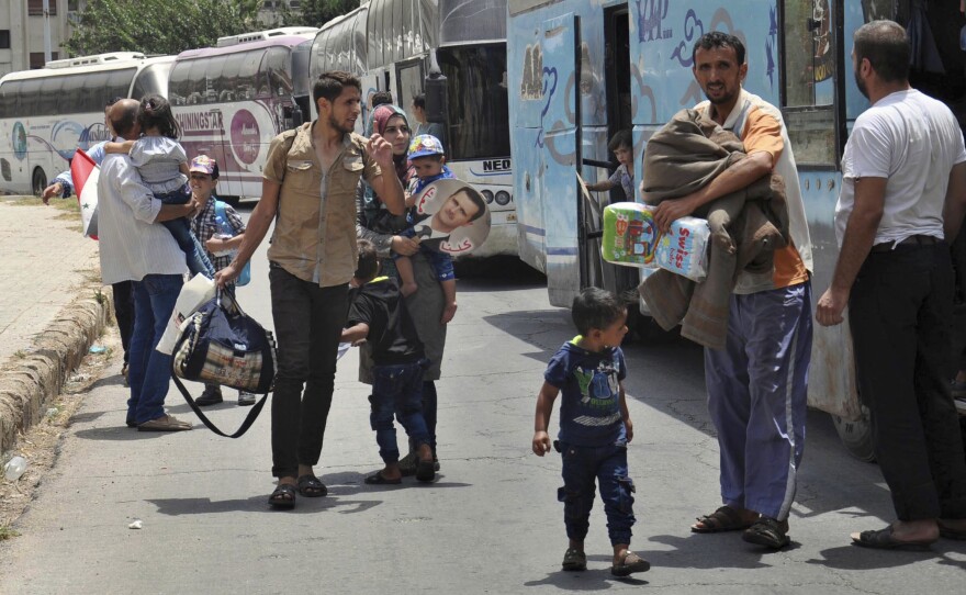 Syrians arriving last month from Jarablus, in Aleppo province, to their old neighborhood of al-Waer, in Homs, Syria. They left their homes to escape the government of Syrian President Bashar Assad, and now they are going back.