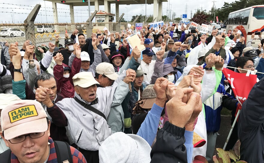 Protesters demonstrate outside a U.S. Marine base on Okinawa. The U.S. plans to greatly expand the base in the rural fishing village of Henoko.