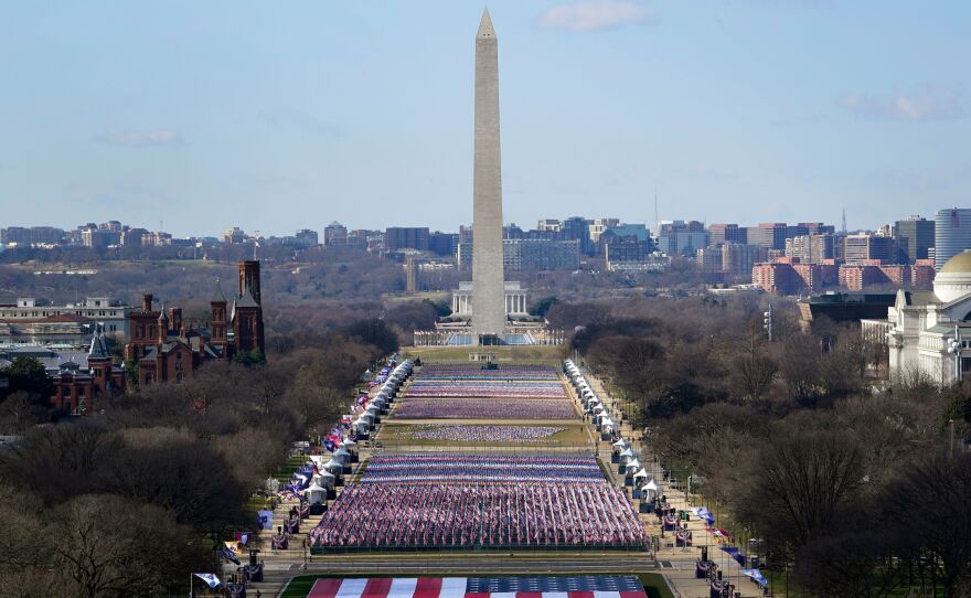 Thousands of flags make up the "Field of Flags" on the National Mall, representing the thousands of people who cannot attend the inauguration because of the pandemic and tight security in the nation's capital.