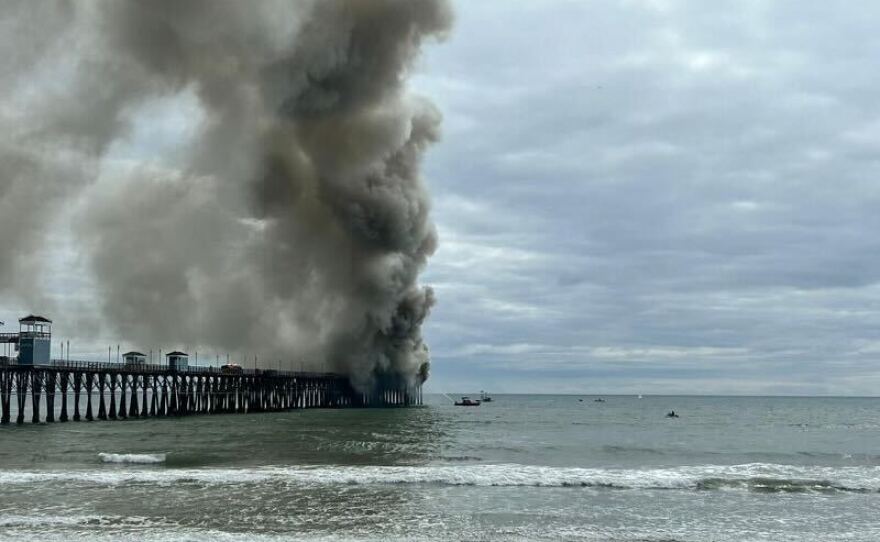 A fire is seen at the end of the Oceanside Pier. Oceanside, Calif. April 25, 2024.