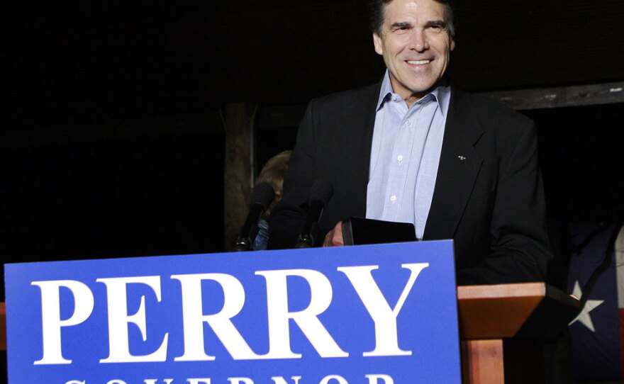 Texas Gov. Rick Perry smiles as he takes the stage to speak to supporters at his victory party Tuesday night at the Salt Lick BBQ in Driftwood, Texas.