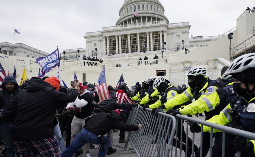 Trump supporters try to break through a police barrier Jan. 6 at the U.S. Capitol in Washington, D.C.