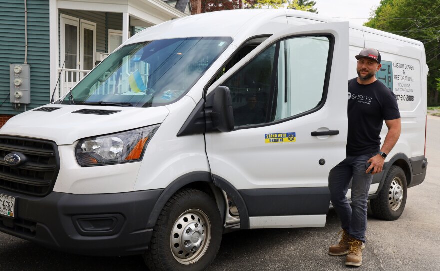 Oleg Opalnyk climbs into his work van after checking in on the Ukrainian families living at the apartment building he owns in Auburn, Maine. Opalnyk says supporting the families can feel overwhelming at times, but that he's thankful to be able to help.