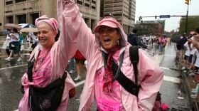 Lindsay Ullman, 31 (left), celebrates with her mother, Dyana Peters, as they cross the finish line after their first 5K walk during the 2008 Susan G. Komen Northeast Ohio Race for the Cure. Ullman is battling breast cancer, and Peters is a one-year survivor.