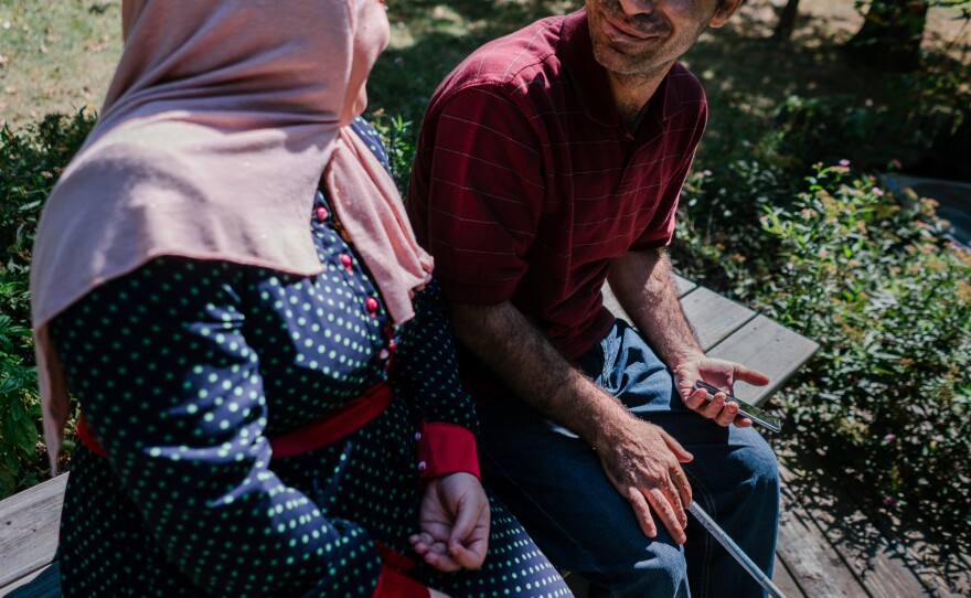 Ghada and Osama sit on their deck in their new home in Princeton, N.J. Their family has been resettled from Syria and is being sponsored by the Nassau Presbyterian Church. Due to security concerns we are only including first names.