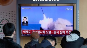 A TV screen shows a file image of North Korea's missile launch during a news program at Seoul Railway Station in Seoul, South Korea, Wednesday, April 8, 2026.