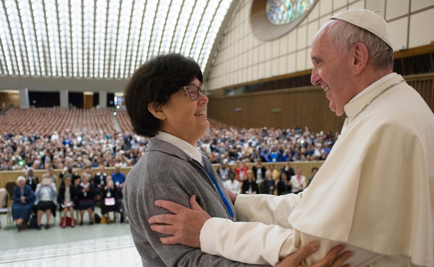 Pope Francis hugs Sister Carmen Sammut at the end of a meeting in May with hundreds of women who serve the Roman Catholic Church. The pontiff has appointed a commission to study whether women can serve as deacons.