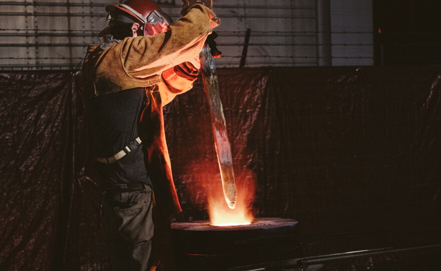 The saber from Confederate Gen. Robert E. Lee's statue is plunged into a crucible to be melted down.