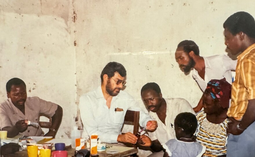 Joel Breman trains scientists in malaria diagnosis in Côte d'Ivoire, 1986. Breman died this month at age 87.