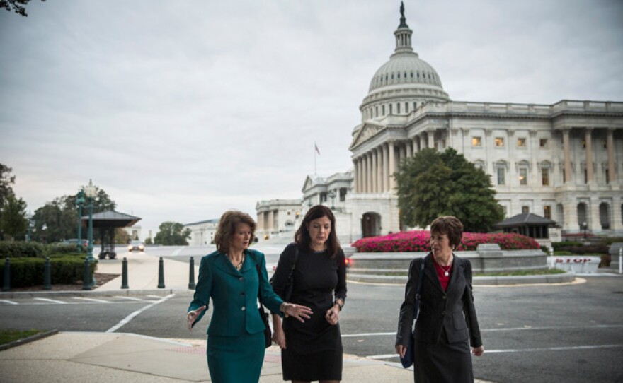 Washington, D.C. - October 16: (L-R) Sen. Lisa Murkowski (R-AK), Sen. Kelly Ayotte (R-NH) and Sen. Susan Collins (R-ME) walk past the Capitol Building after praying with a group of religious leaders and also appearing on national television on the morning of October 16, 2013 in Washington, DC. Today marks the 16th day of the government shutdown and the last day to find a solution before the government could potentially begin defaulting on debts.