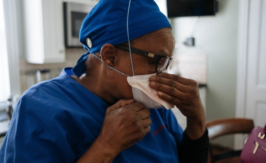 Health care workers were forced to come up with ways to preserve N95 masks. Raymonde Elian wore three masks so that the N95 was less exposed.
