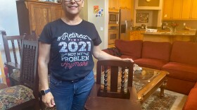 Norma Jasso, 62, sped up retirement plans after her daughter asked for help with a new baby. She stands with a highchair her father had commissioned from a shop in Sinaloa, Mexico. Her daughters used it and now her grandson will too.