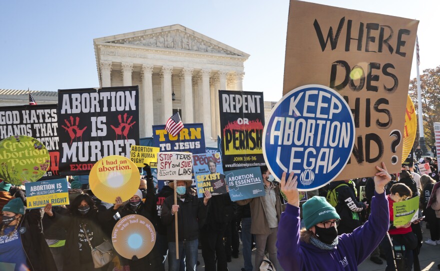 Demonstrators gather in front of the U.S. Supreme Court on Dec. 1 as the justices hear arguments in a key case about a Mississippi abortion law.