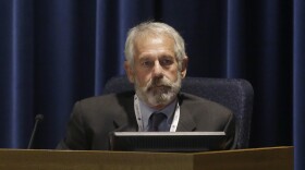 California Public Utilities Commissioner Michael Picker listens to speakers during a meeting of the five-member commission in San Francisco, Dec. 18, 2014.