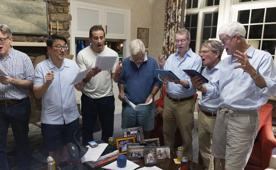 Youngmoo Kim (left) leads members of the a cappella group the Tonics in singing an arrangement of the song "Everything" by Michael Bublé at their weekly rehearsal in Bryn Mawr, Pa. in September.