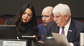 Newly appointed San Diego Association of Governments board chair Nora Vargas, left, speaks with SANDAG attorney John Kirk, middle, and CEO Hasan Ikhrata during a meeting on Jan. 13, 2023.