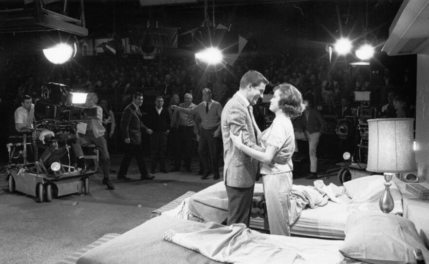 Dick Van Dyke and Mary Tyler Moore perform in front of a studio audience.