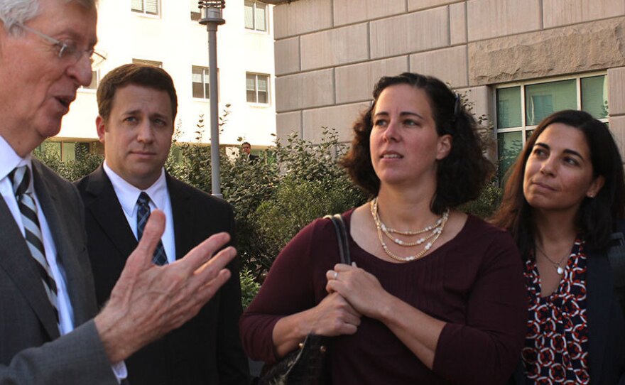 Sasha Ballen and Dee Spagnuolo (far right), the first couple to receive a marriage certificate issued to a same-sex couple in Pa., are now party to two of five lawsuits filed since the U.S. Supreme Court struck down a section of DOMA back in June. Attorney Robert C. Heim (left) is helping to represent them.