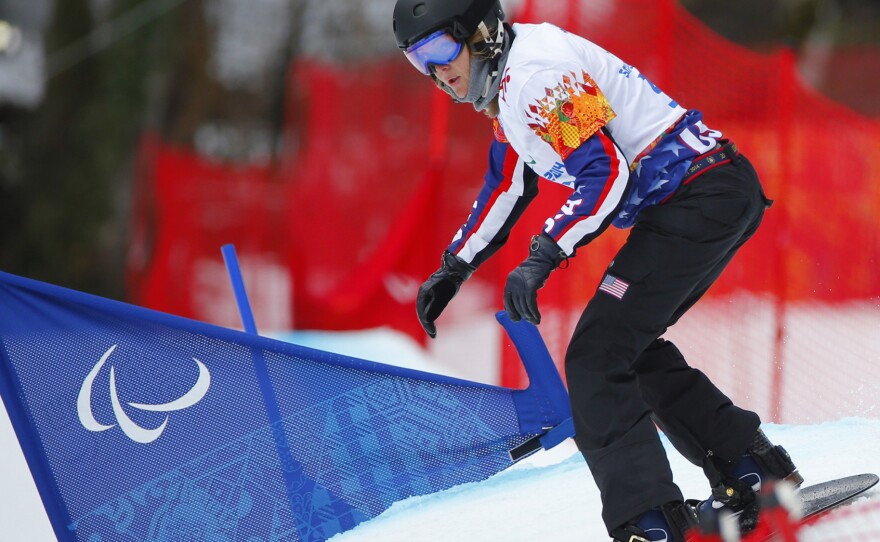 Purdy competes in the women's snowboard cross in the 2014 Winter Paralympics in Russia.