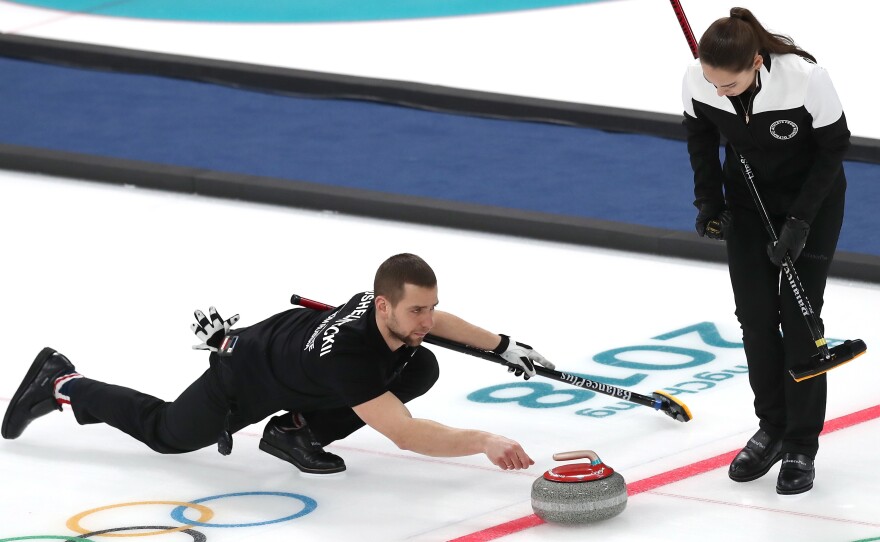 Aleksandr Krushelnitckii, seen here competing with his teammate and wife Anastasia Bryzgalova, has tested positive for a banned substance, the Olympic Athletes from Russia says. The pair won a bronze medal at the Pyeongchang Winter Olympics.