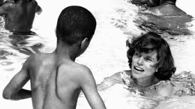 Eunice Kennedy Shriver swims with youngsters at a day camp for mentally challenged children in Philadelphia's Fairmount Park in August 1964.