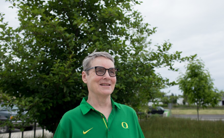 Peg Rees led the physical education department at the University of Oregon for decades. Now retired, she announces play-by-play commentary for UO home softball games.