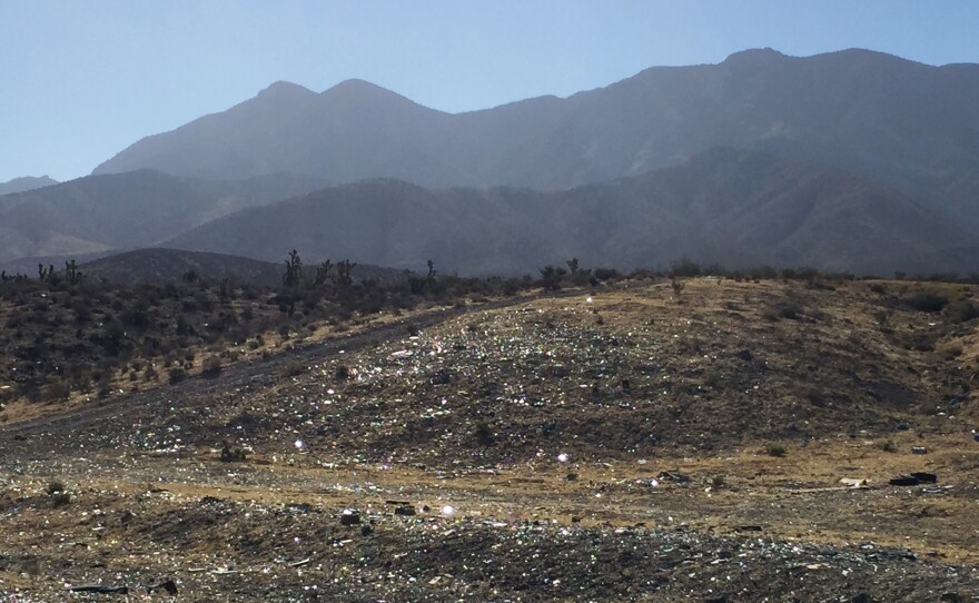 Shotgun shell casings and broken glass litter part of Nalen's patrol area in the Nevada desert.