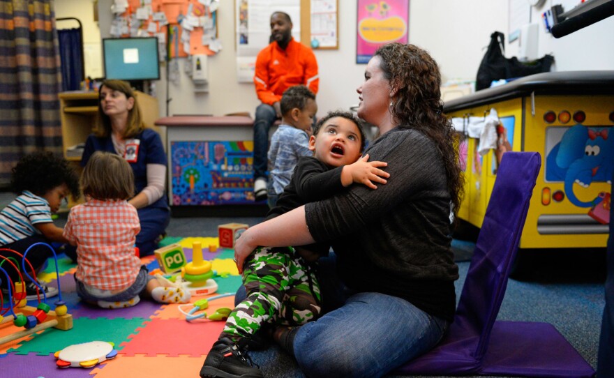 Kelly Zimmerman holds her son Jaxton Wright at a parenting session at the Children's Health Center in Reading, Pa. The free program provides resources and social support to new parents in recovery from addiction, or who are otherwise vulnerable.
