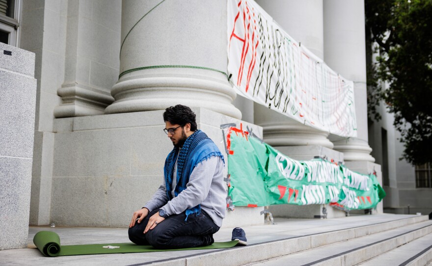 UC Berkeley Student Yahya Ahmed prays at the UC Berkeley Gaza Solidarity Encampment in front of Sproul Hall on Apr. 23, 2024.