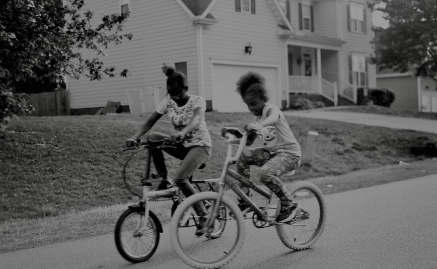 Photographer Laila AnnMarie Stevens' nieces race down the neighborhood on their new bikes in Clayton, N.C.